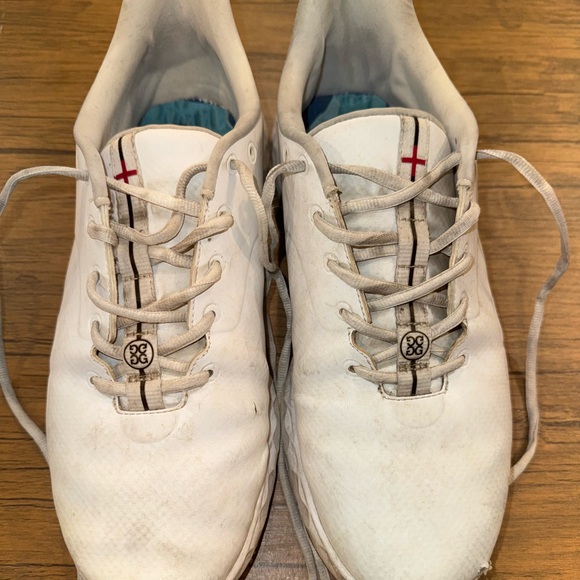 White Athletic Shoes with Red and Black Accents